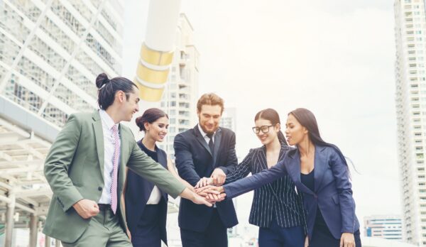 Close up of business people hands together. Teamwork concept.